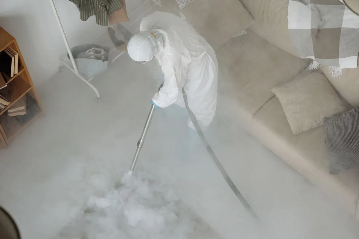 Biohazard cleanup technician in protective equipment, Fall Creek, WI